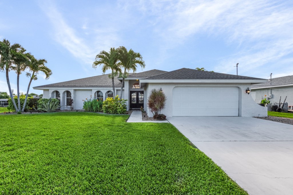 Ample driveway space and garage, offering easy access and convenience during your stay.