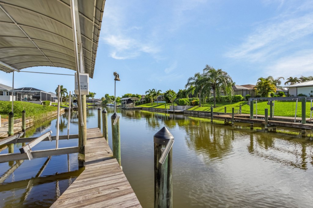 Scenic canal views from the dock, perfect for fishing or soaking up the peaceful surroundings.