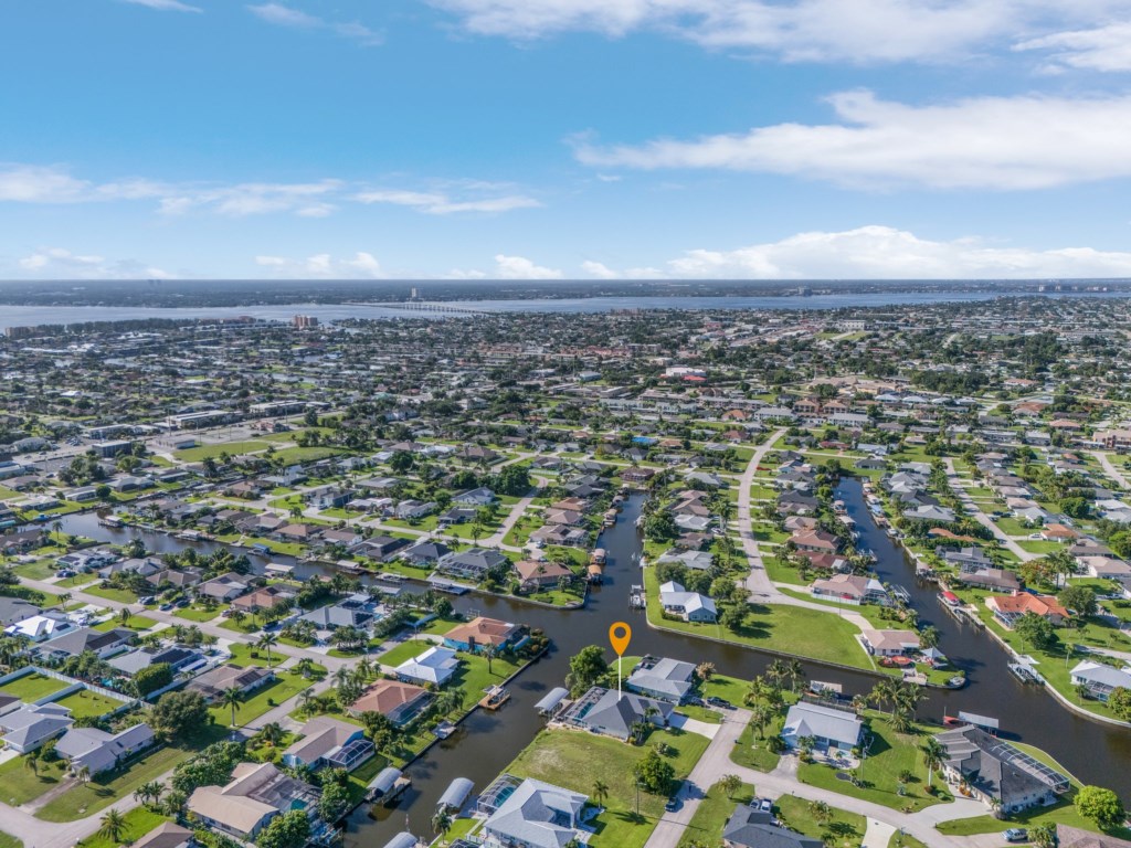 Stunning aerial view of the canal-side neighborhood, minutes from local attractions and the coast.