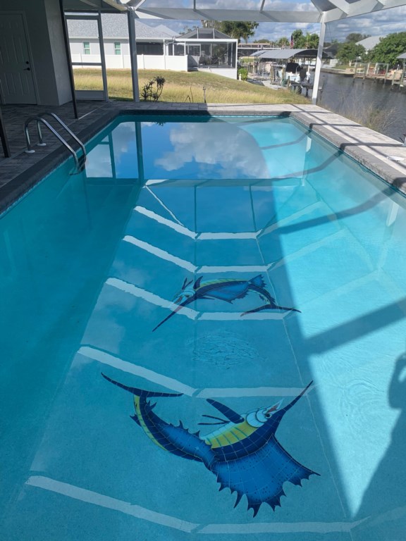 Unique pool with built-in seating, perfect for relaxing while staying cool.