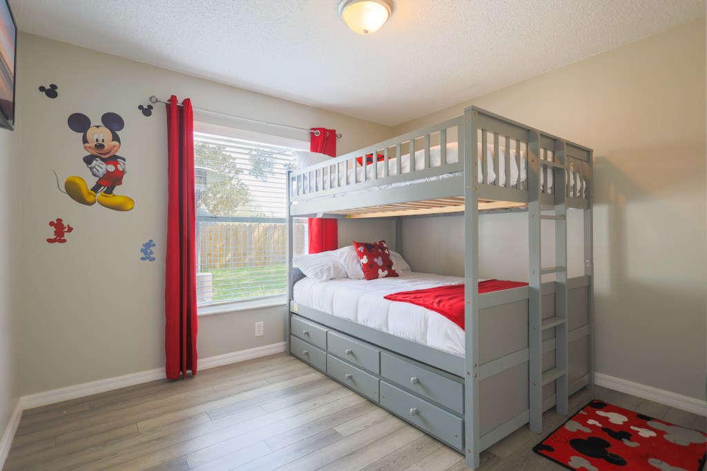 Mikey Mouse Theme room with two full size beds.
