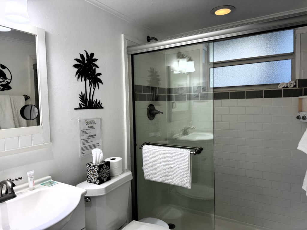 Each bathroom contains product dispensers, a hand soap, 2 toilet paper rolls, & cosmetic towels for 