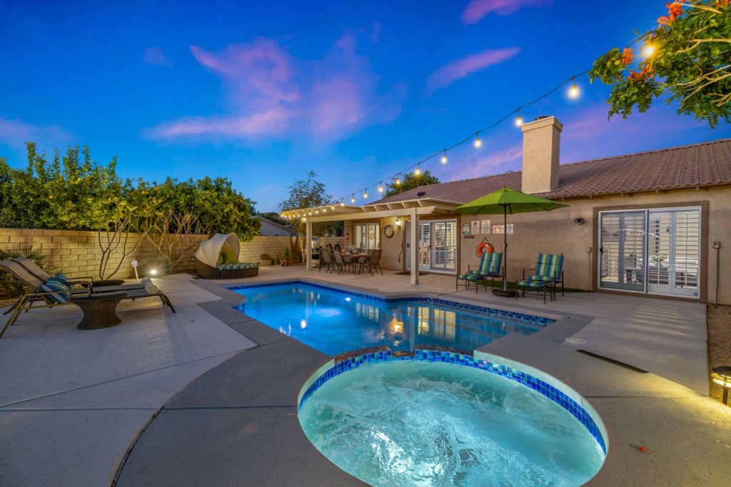 This poolside oasis captivates with its breathtaking views and tranquil ambiance,