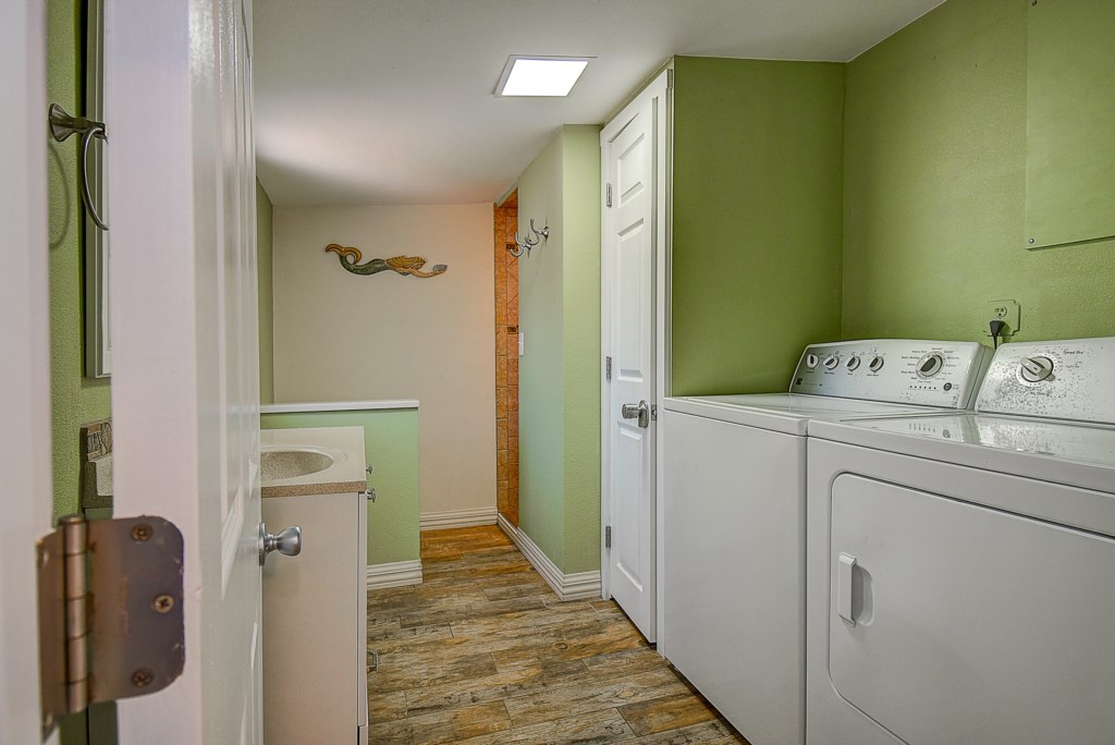 Bathroom #1. Full sized bathroom with a shower and the washer and dryer.