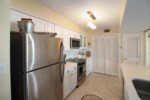 Laundry room located right off the kitchen with full size washer and dryer.