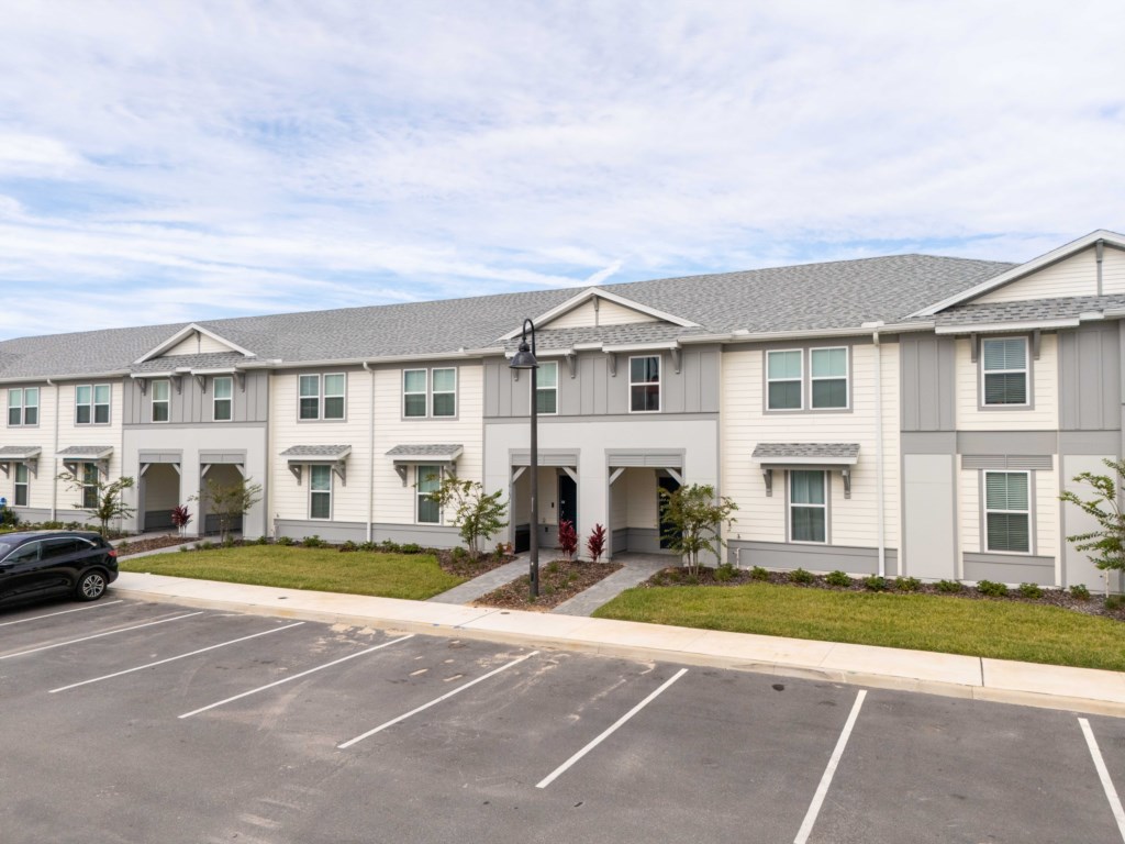 Exterior of the home w/ parking available at the front.