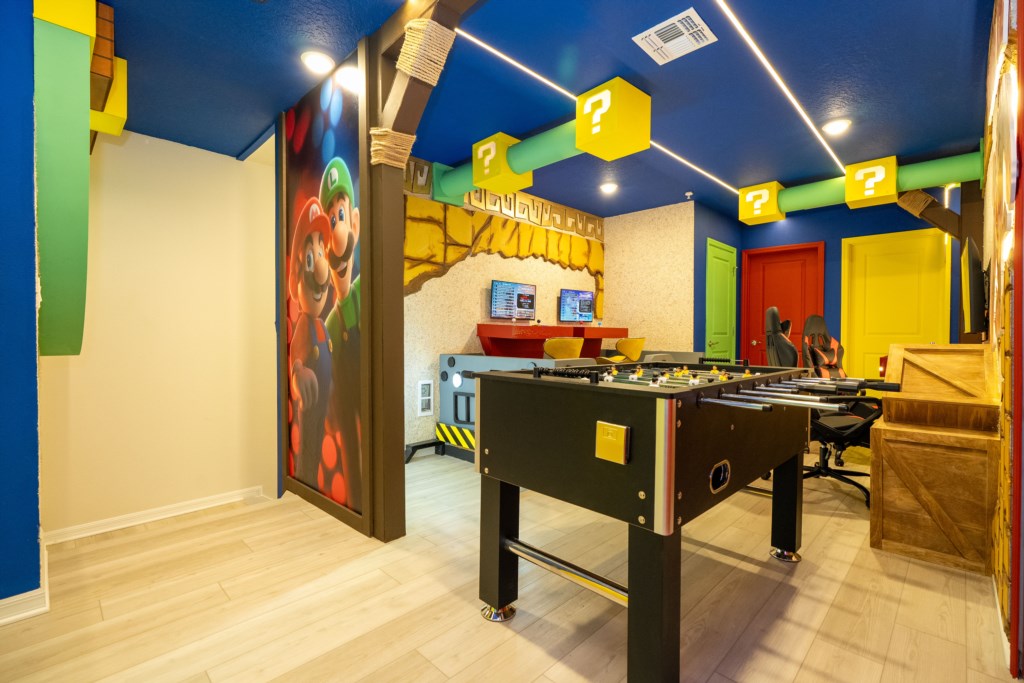 Donkey themed game room with arcades and foosball table
