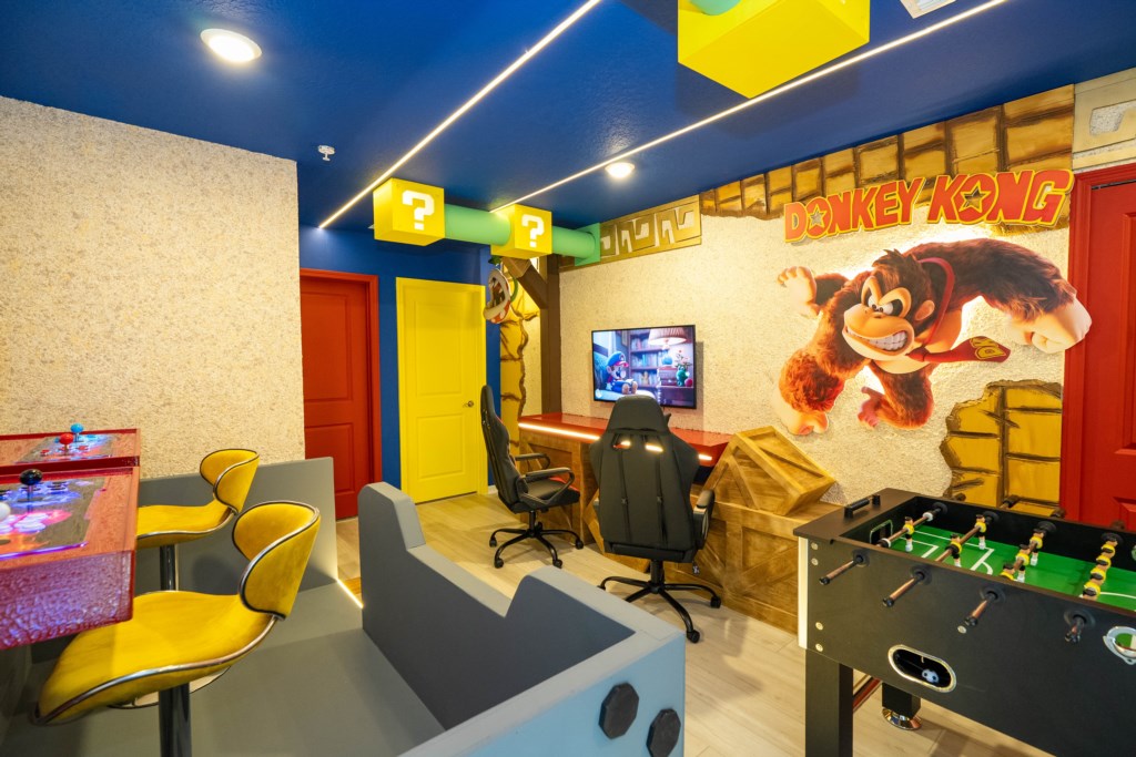 Donkey themed game room with arcades and foosball table