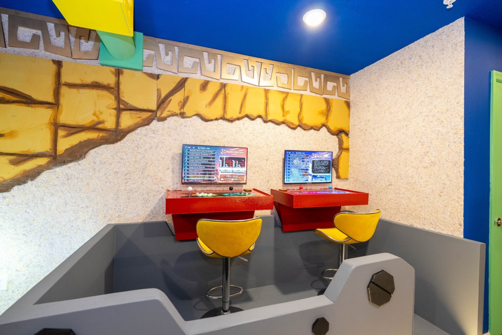 Donkey themed game room with arcades and foosball table