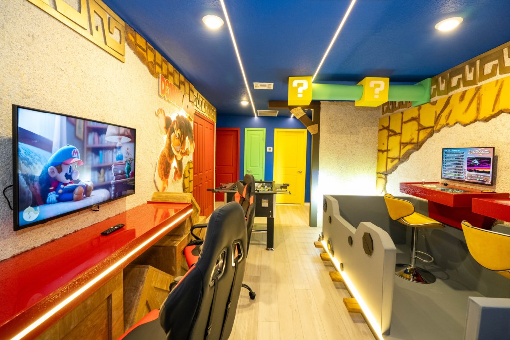 Donkey themed game room with arcades and foosball table