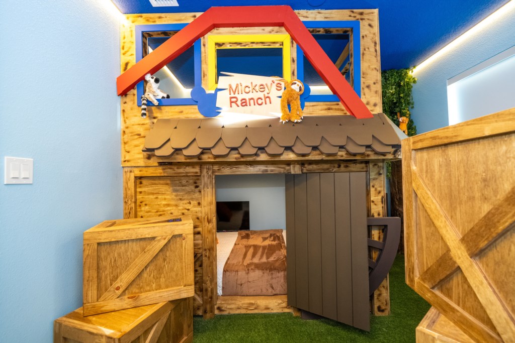 Mickey's Ranch themed bedroom w/ 2 full beds & 2 TV's