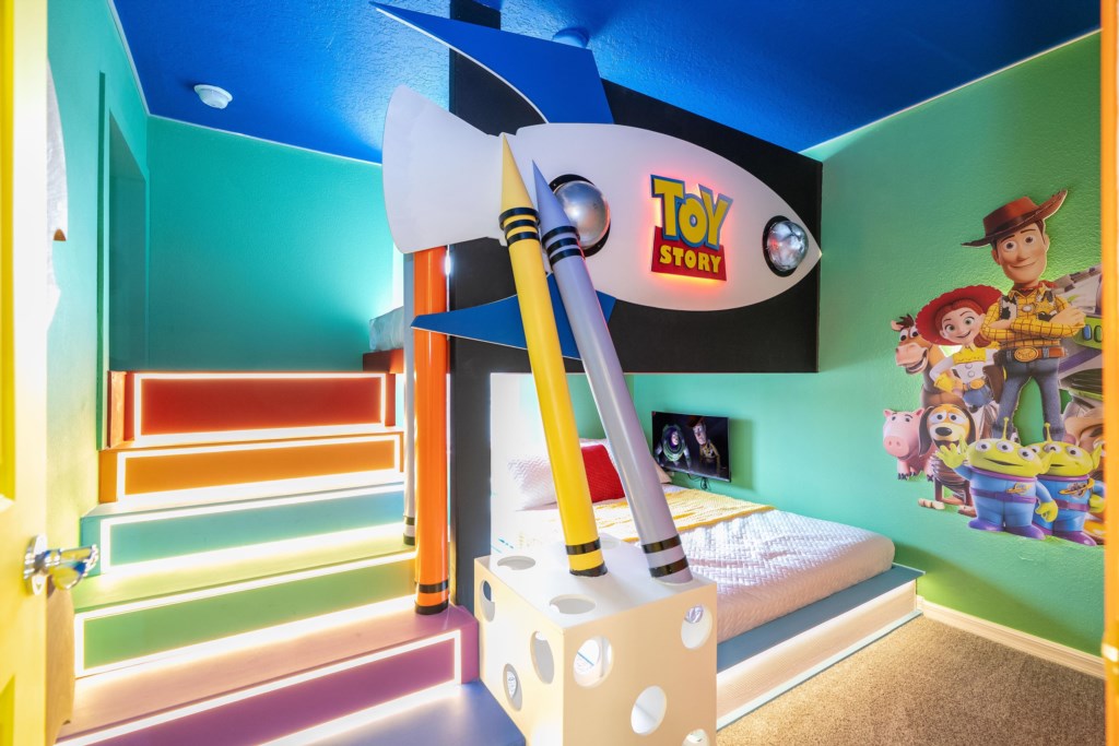 Toy Story bedroom with secret passage to the Mickey themed bedroom (2 full beds & 2 TV's).