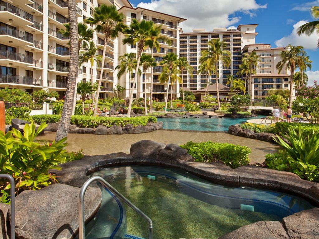 View of the Ko Olina Beach Villas Beach Tower and Ocean Tower from the Lagoon Pool hot tub.