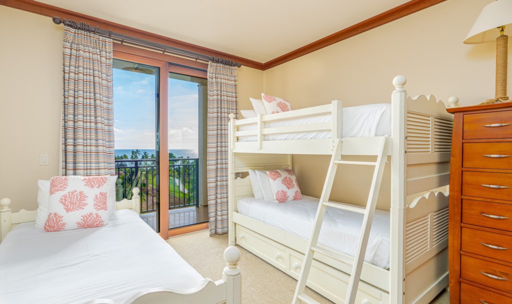 Bedroom 3 with bunk beds, an extra twin bed, and lanai access.