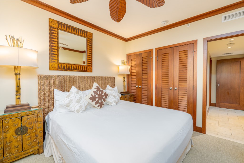 Queen bedroom with smart TV.