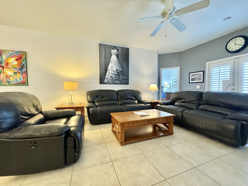 Bright and cozy living room with ample seating for your family to unwind.