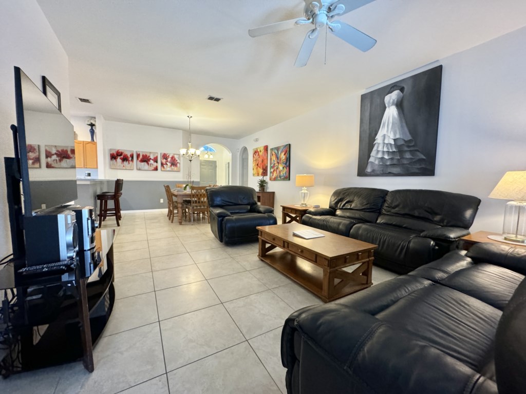 Comfortable open-plan living room with plush seating and plenty of natural light.