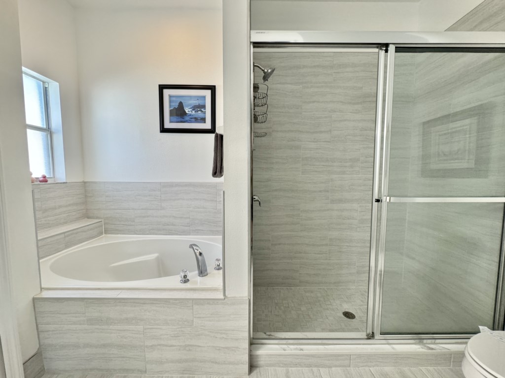 Relax in the soaking tub or enjoy a refreshing shower in this modern bathroom.