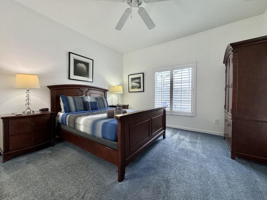 Cozy bedroom with a comfortable bed and plenty of natural light.