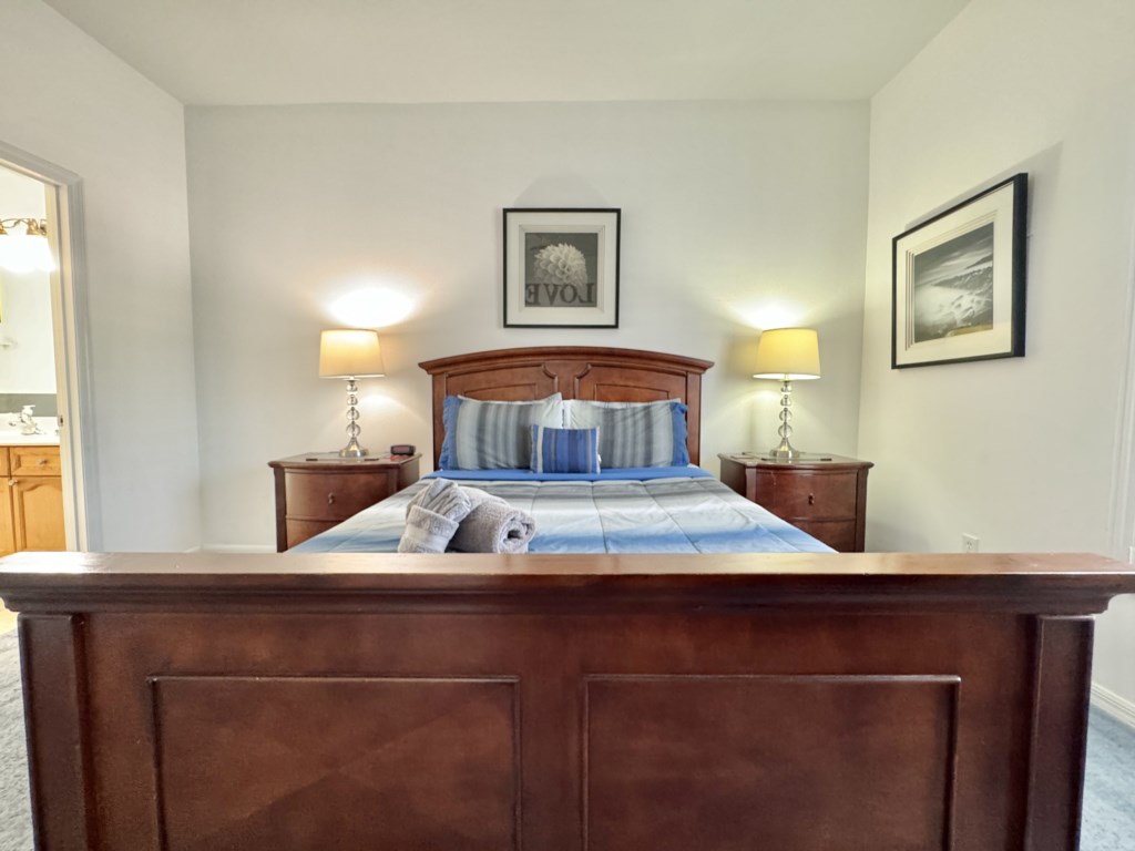 Charming bedroom with wooden furnishings and peaceful decor.