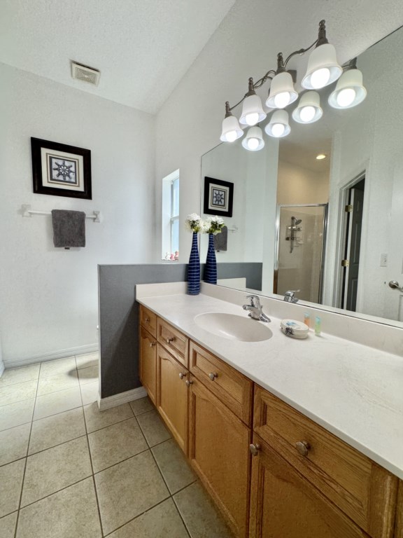 Bright bathroom with dual-sink vanity, perfect for shared convenience.