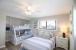 The guest bedroom offers both a queen size bed and bunk beds, perfect for the kids