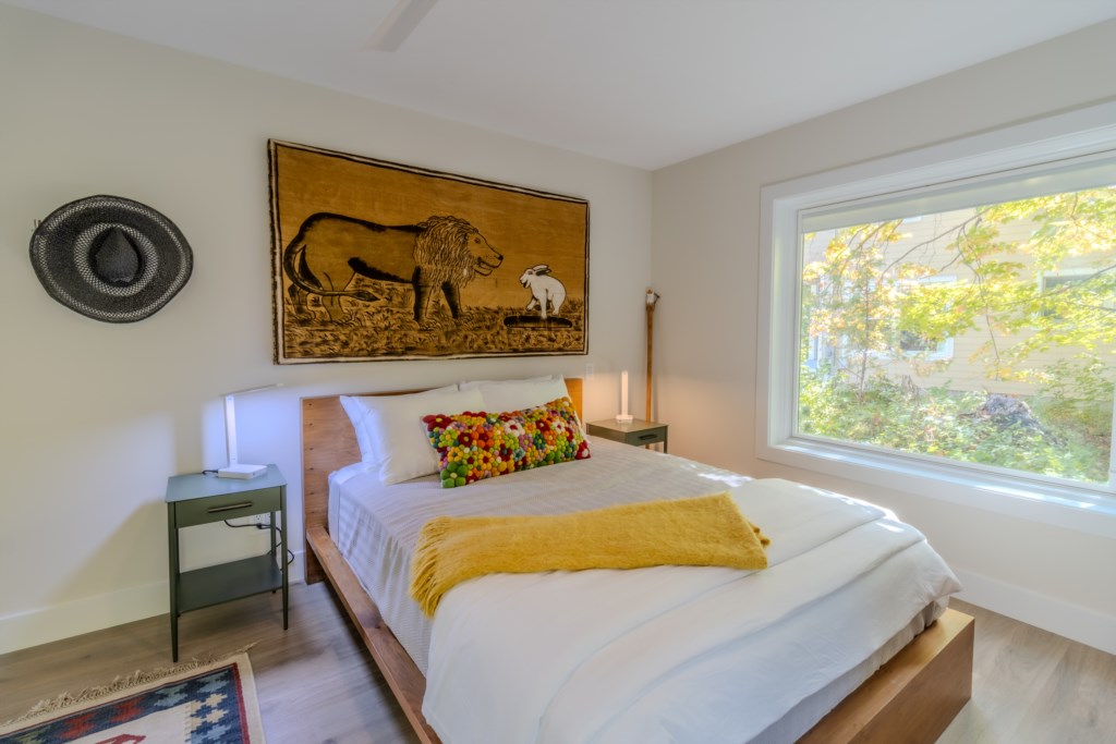 guest room 1 with queen bed and desk