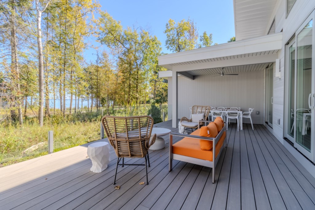 Front deck lounge seating, dining table and grill