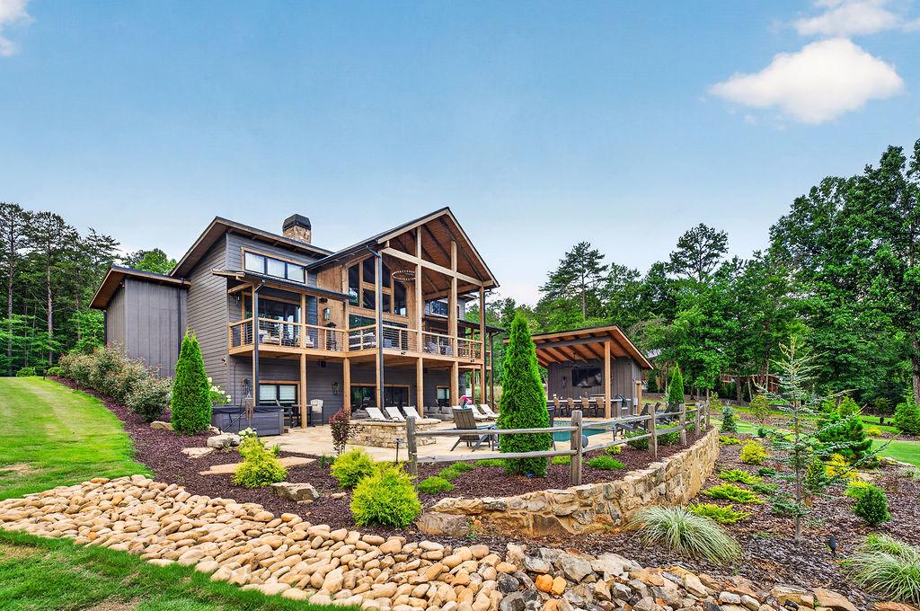 Stunning cabin with expansive decks and lush garden views for a serene retreat.