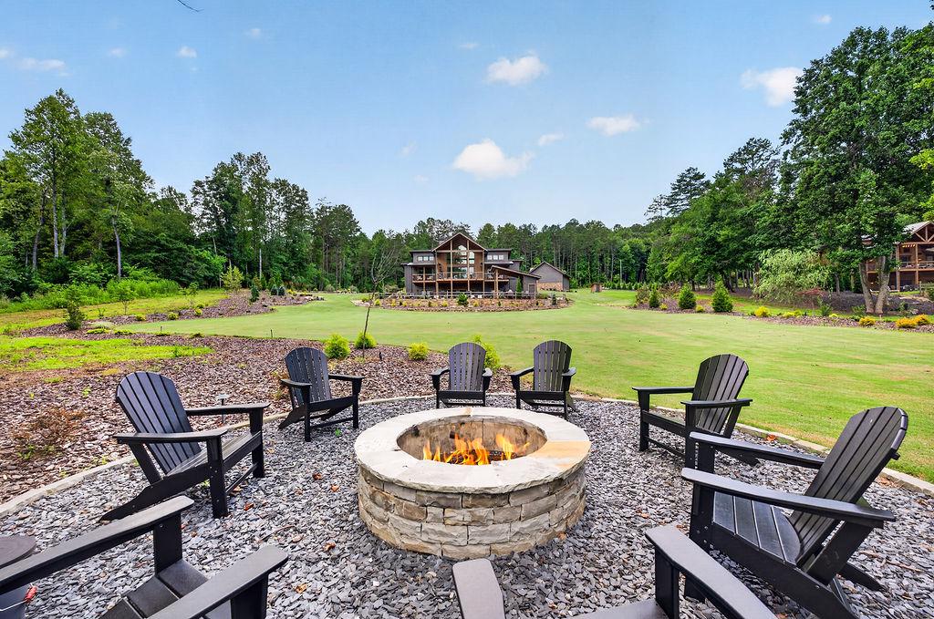 Relax by the custom firepit with Adirondack chairs, perfect for evening gatherings.