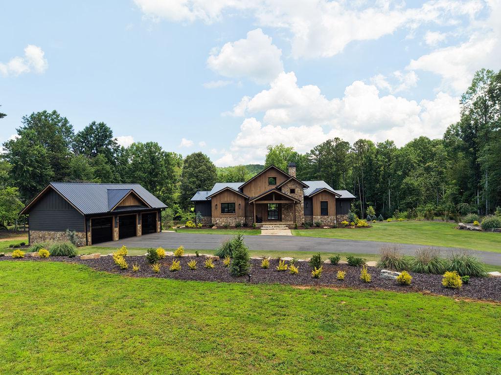 Charming rustic retreat with spacious grounds and serene wooded surroundings.