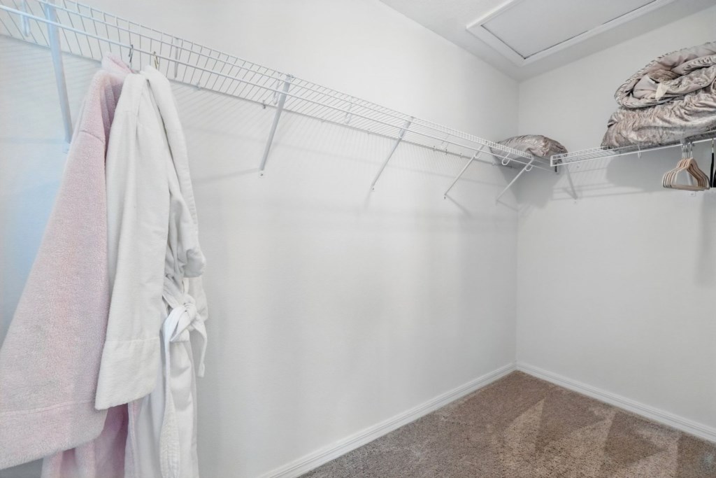walk-in closet with king's & queen's bathrobes...