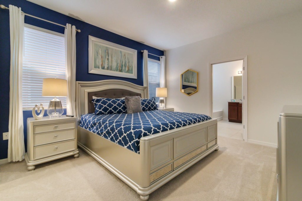 spacious bedroom and comfortable bed with its own bathroom