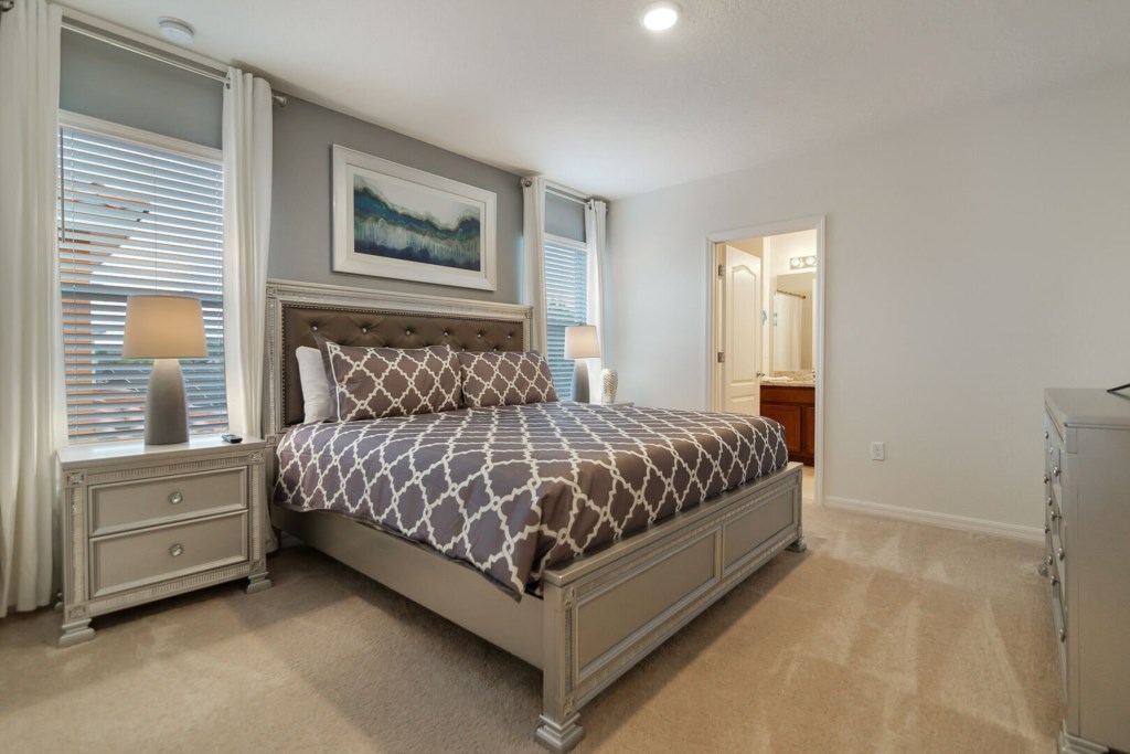 spacious bedroom and comfortable bed with its own bathroom