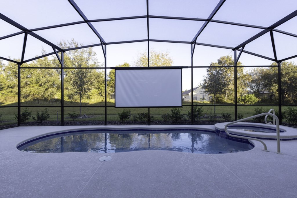 pool with a big projector - perfect for swimming or lounging.