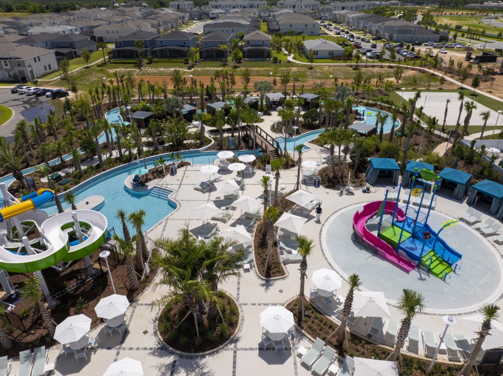 Windsor Cay Resort - resort style pool featuring water slide, lazy river, cabanas, mini-golf, volleyball and more!