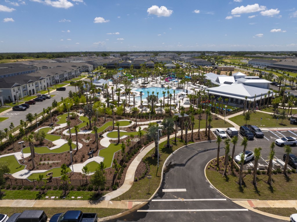 Windsor Cay Resort - resort style pool featuring water slide, lazy river, cabanas, mini-golf, volleyball and more!
