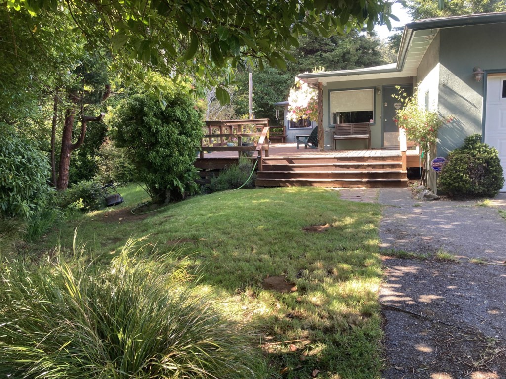 Front of house, end of road.