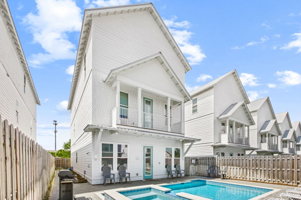 The spacious pool area has a spa and umbrella deck