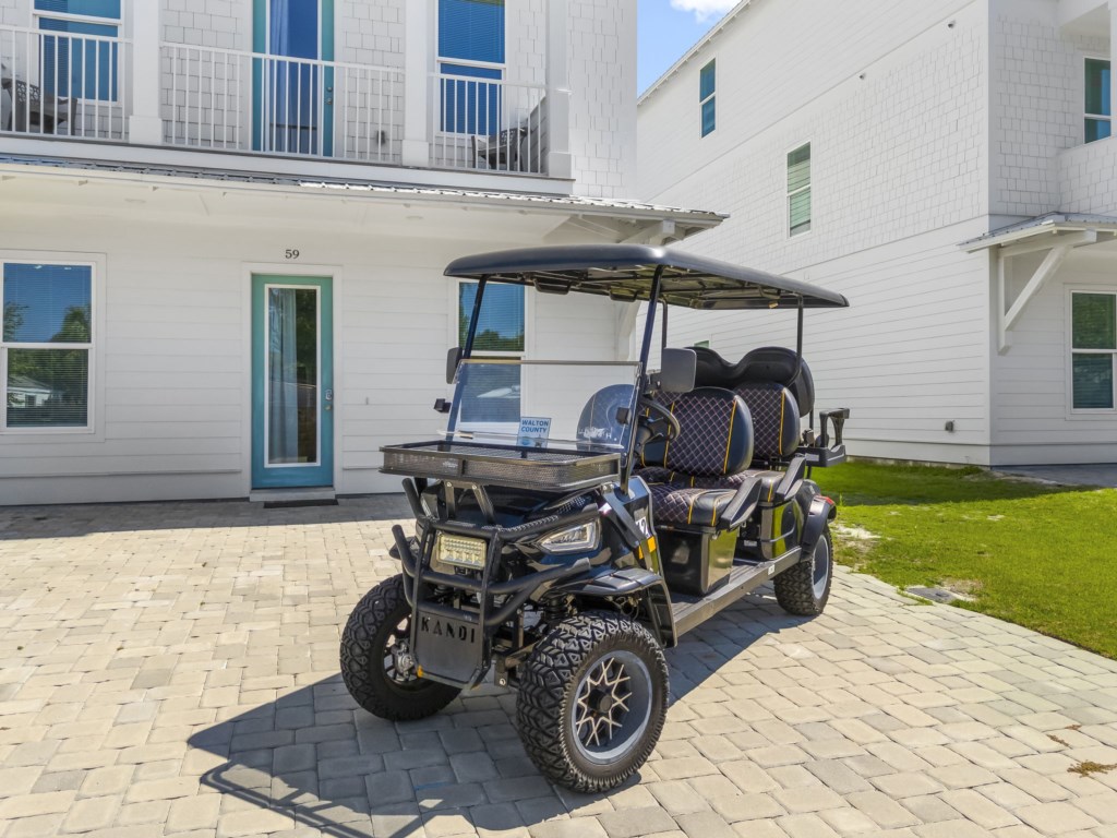 Complimentary golf cart for exploring the resort-style surroundings.
