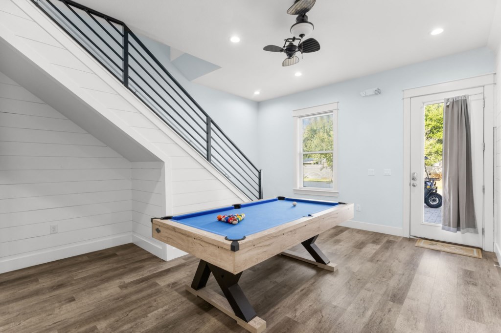 Modern games room with pool table, perfect for family fun and relaxation.