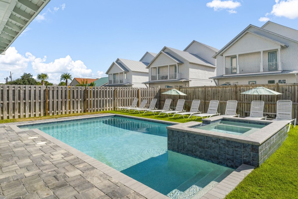 Sunny pool area with loungers, perfect for a relaxing day outdoors.