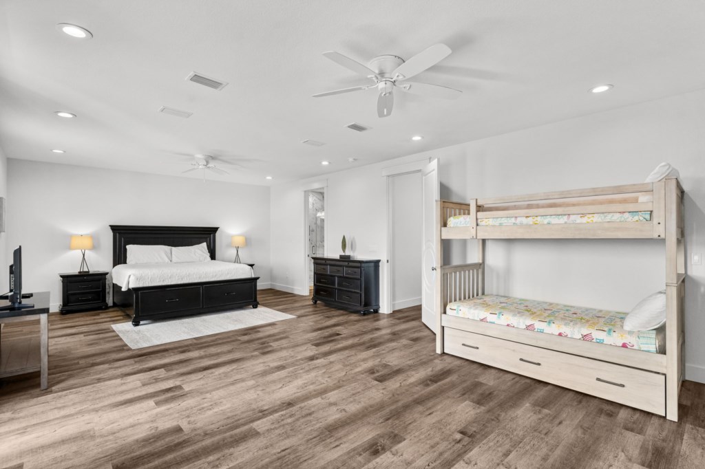 Guest Bedroom With King Bed, Three Twin Beds, and Private Bathroom