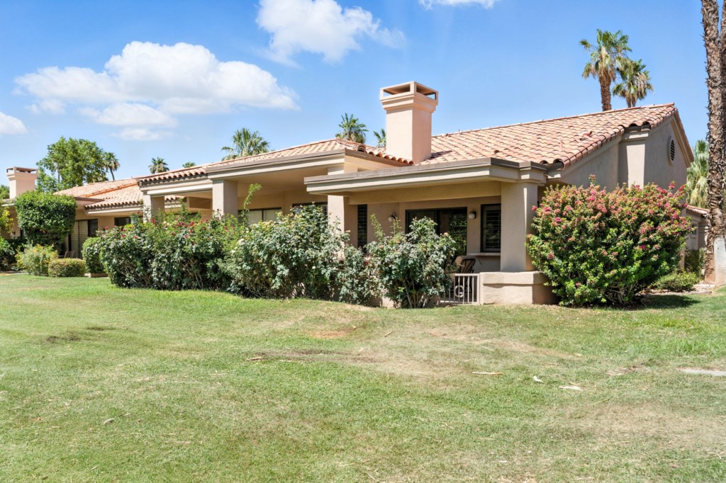 Serene golf course villa surrounded by lush greenery, perfect for relaxation.