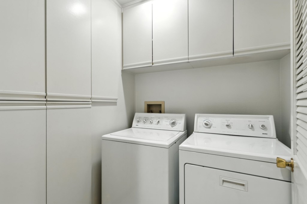Convenient in-unit laundry room with appliances.