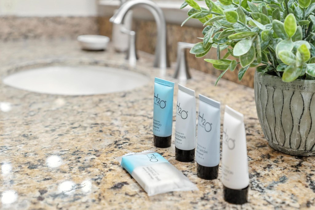Freshen up with complementary toiletries in this well-appointed bathroom.
