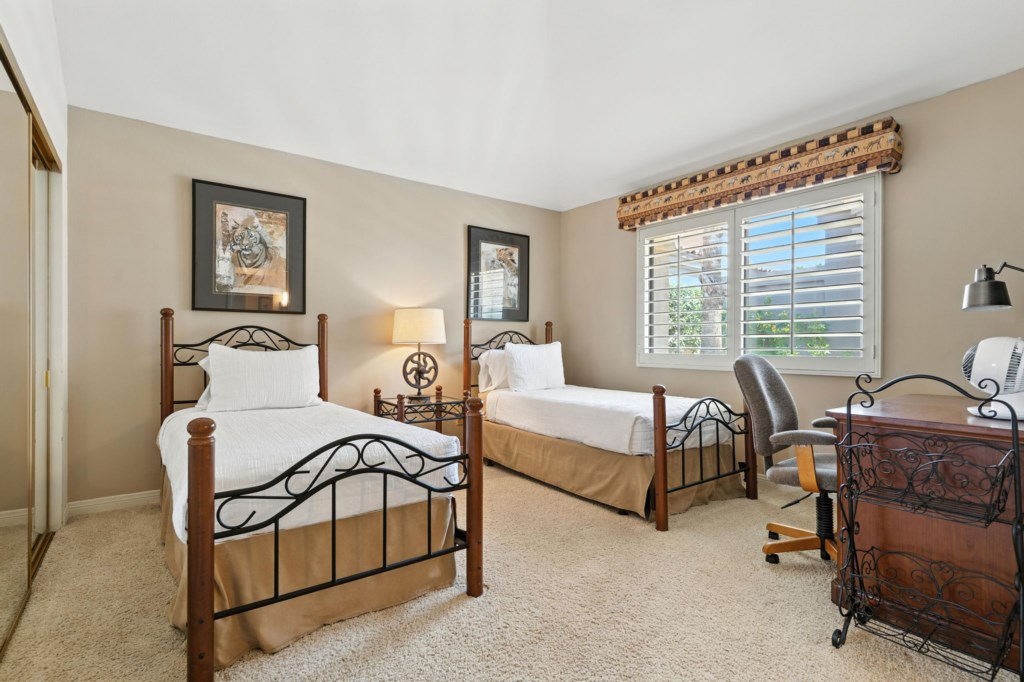 Cozy iron-frame beds, ideal for family or friends.