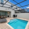 Private pool area with screened enclosure and outdoor dining set.