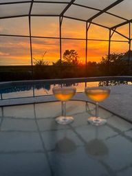 Enjoy a breathtaking sunset view, perfectly complemented by a refreshing glass of wine, creating memorable times.