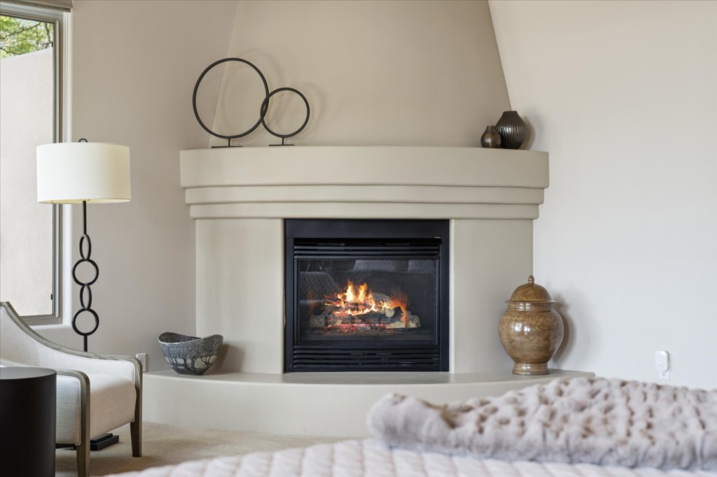Elegant living room with a modern fireplace and cozy seating.